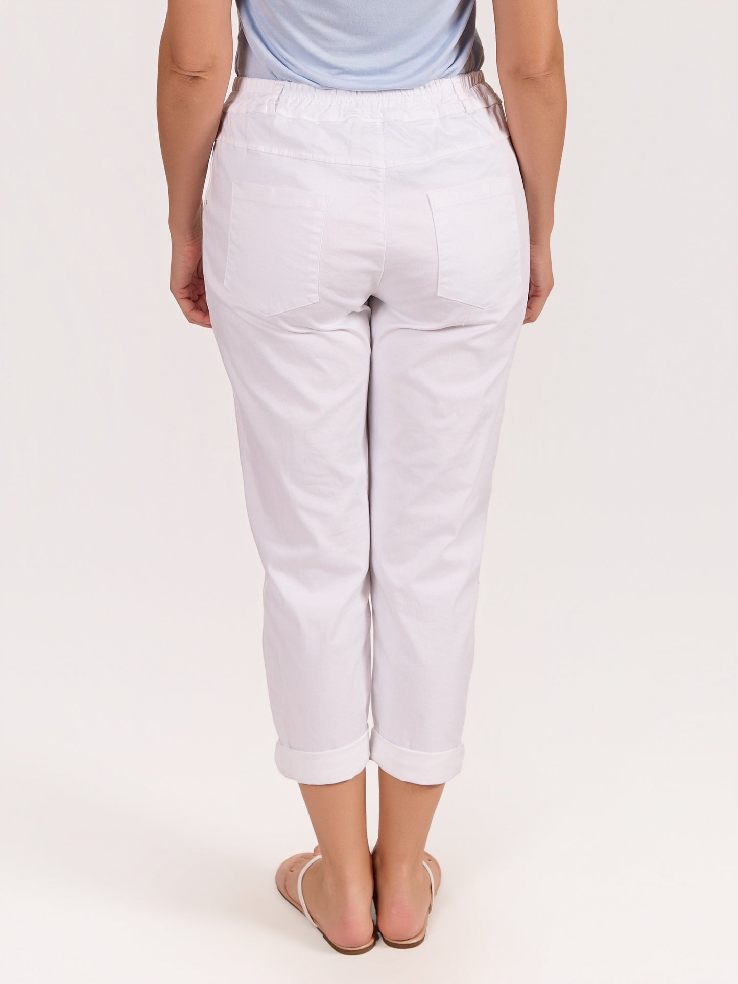 Pantalon blanc à boutons strass avec fermeture éclair à l’avant