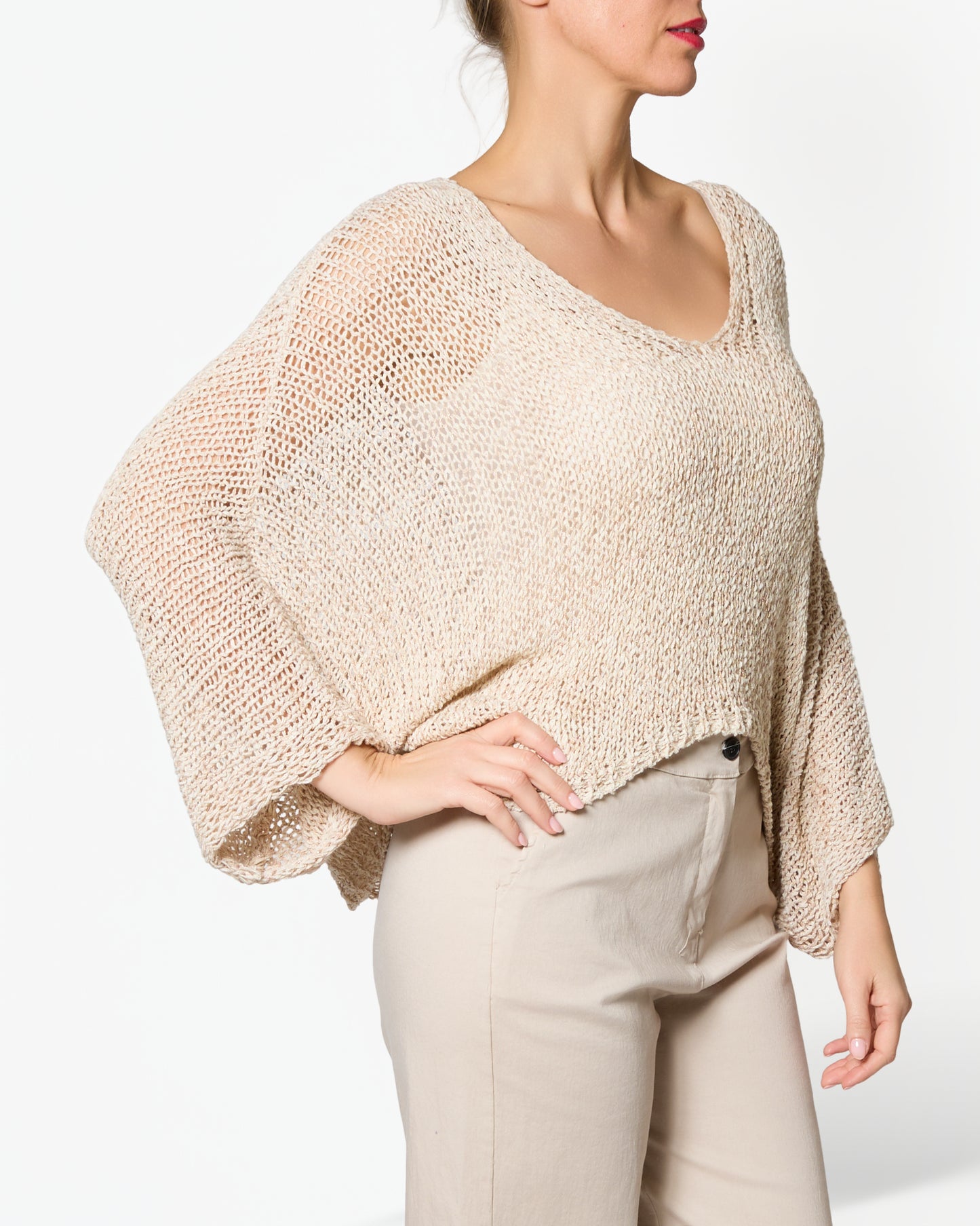 Pull beige à col en V à épaules tombantes et ourlet à motif chiné