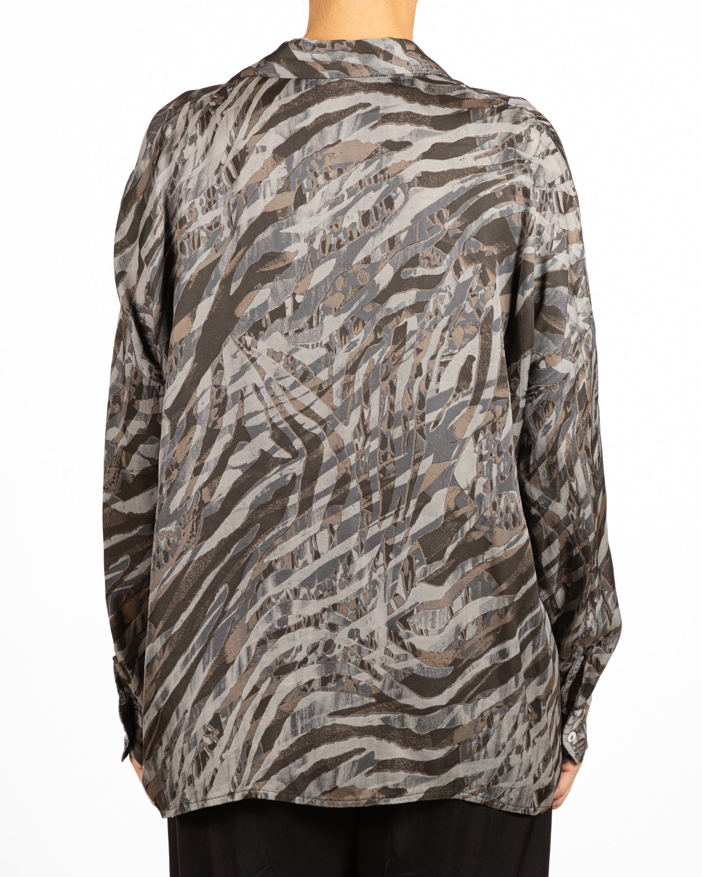 Haut imprimé animalier à boutons en pierre sur le devant