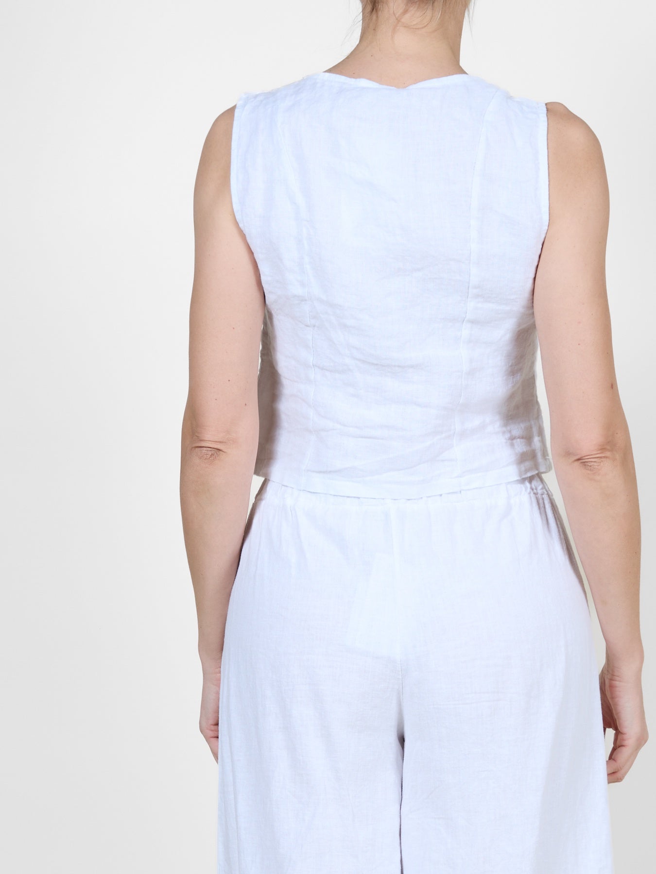 White Button-Front Sleeveless Vests