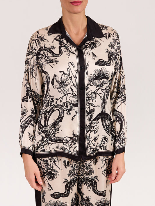 Blouse ivoire et noire à imprimé botanique avec boutons à l’avant