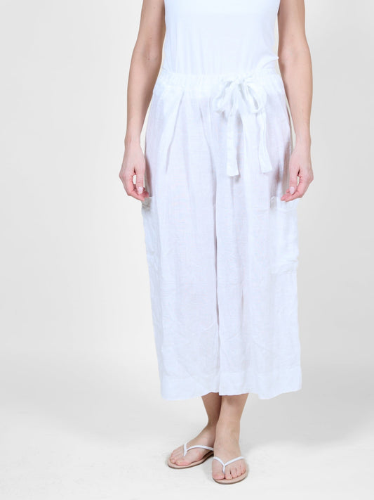 Pantalon de plage blanc court et fluide avec nœud sur le devant